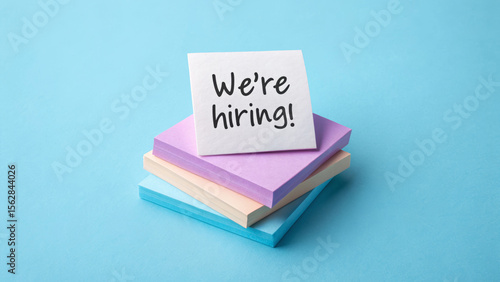 Job labor employment, unemployment. We're hiring message sticky notes, recruitment announcement, blue background, job opportunity . Hiring rate, economic growth, opening workforce market