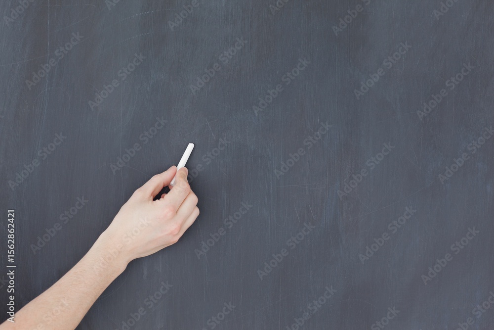 Naklejka premium Hand writing with chalk on board