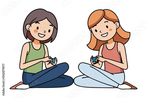 Female Gamers: Two cheerful young women with smiles, cross-legged, deeply immersed in playing mobile games.