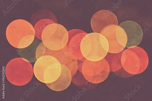Abstract bokeh of vibrant circles in warm hues against a dark background