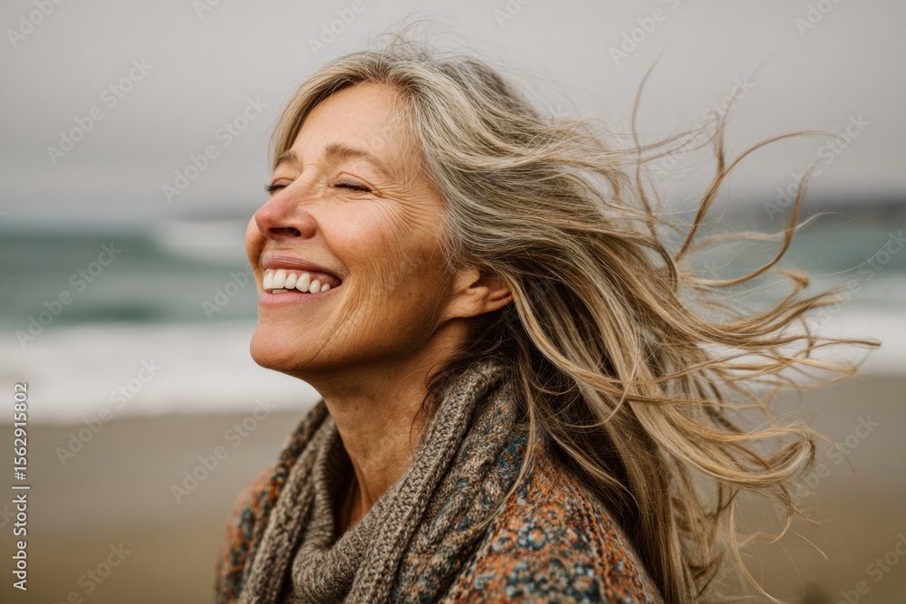 Woman laughing on beach Woman laughing on beach