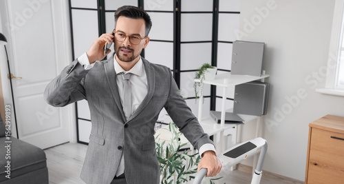 Handsome businessman talkin...