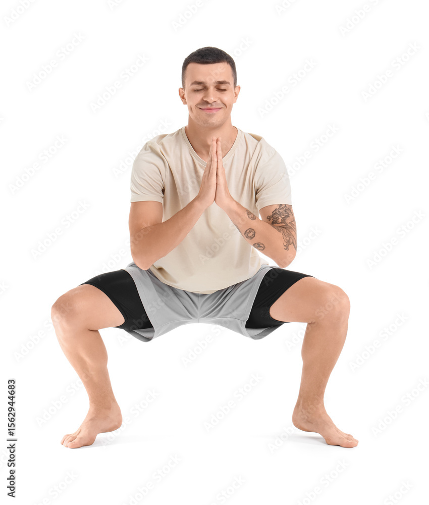 Young man doing yoga on white background Young man doing yoga on white background
