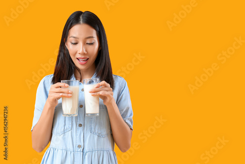 Young Asian woman with glas...