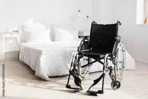 Empty wheelchair in light b...