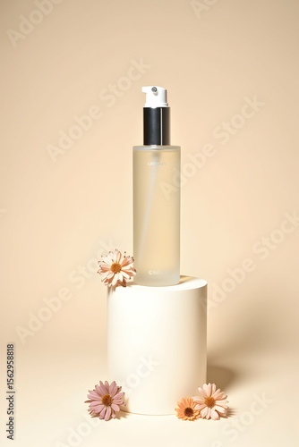 A collection of exquisite perfume bottles, one featuring a beautiful floral accent, captures refined beauty