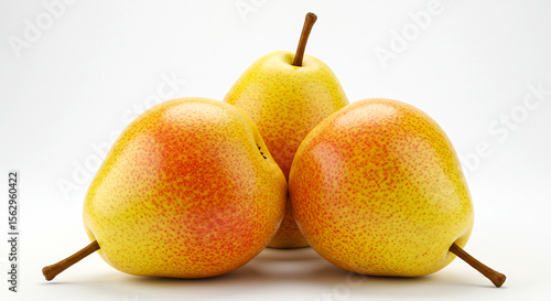 Three ripe, sweet red and yellow pears grouped closely together against a bright white background