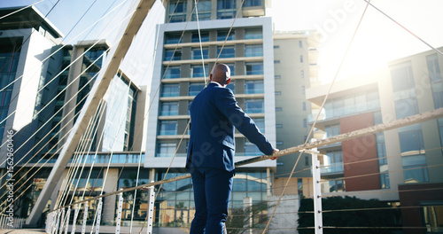 Tableau sur toile Back, business and black man in city, bridge and contemplation with buildings