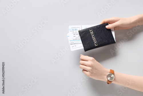 Female hands with passport ...