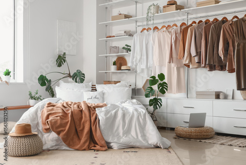 Interior of light bedroom w...