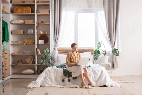 Young woman reading magazin...