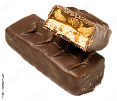 Delicious chocolate caramel nougat peanut candy snack broken on black background