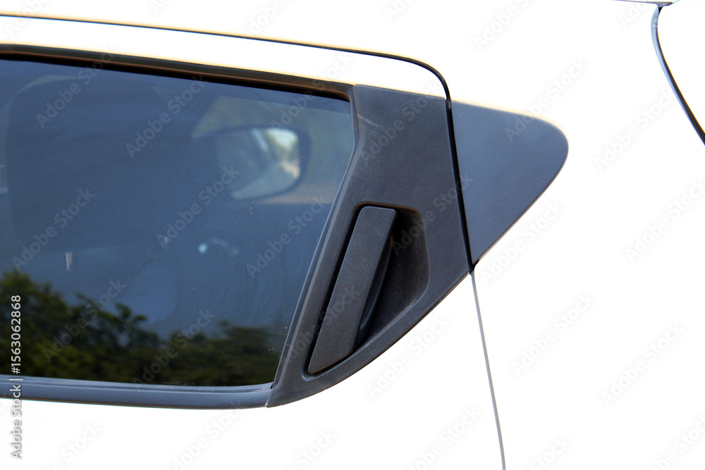 Naklejka premium Black door handle of a white car. Modern car door handle. External car door opening handle at the top. Smart retractable door handles. Car exterior details.
