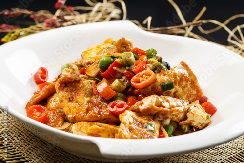 Hunan-style southern tofu in a round white porcelain plate