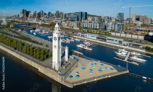 Canvas Print Aerial view of Montreal's Old Port in Canada, showcasing the iconic Clock Tower and marina filled with yachts