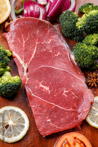 Beef rump on a wooden cutting board