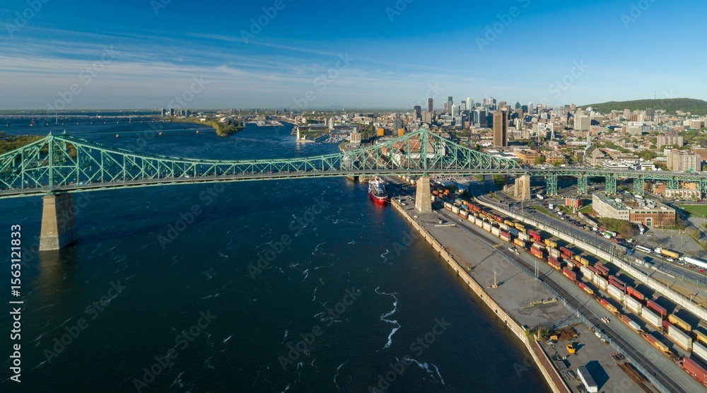 Obraz premium Aerial view of Jacques-Cartier Bridge over the Saint Lawrence River in Montreal, Quebec, Canada. The bridge connects Montreal to Longueuil.