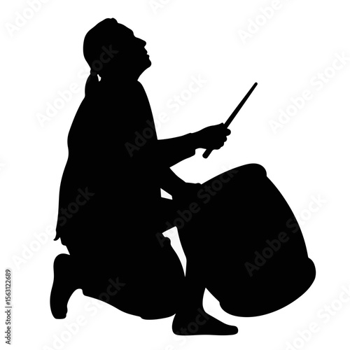 Indigenous man playing ceremonial drum silhouette, cultural expression