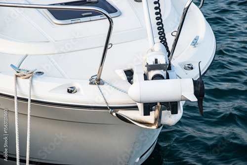 Modern small boat equipped with a bow-mounted electric trolling motor for quiet propulsion