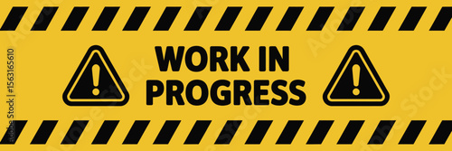 Yellow and black caution sign with bold 'Work in Progress' warning text and hazard icons, indicating active construction or maintenance area