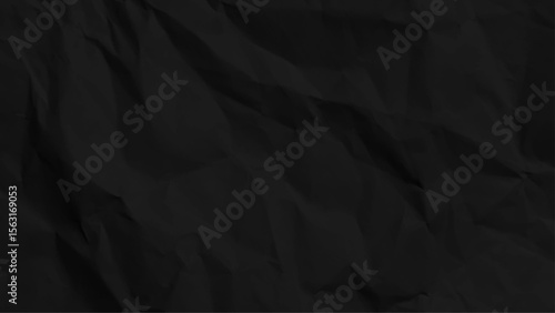 Closeup of black crumpled paper for texture background. Folded black paper texture. Paper with kinks and dents. Black paper texture
