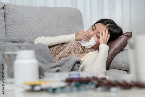 Photos Young Asian woman having high fever while checking body temperature, female snee
