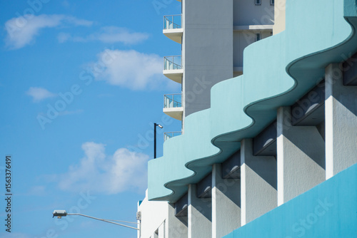 A blue wave like protrusion on the facade on a building