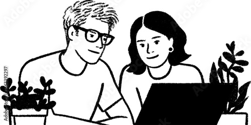 Collaborative work: two coworkers reviewing designs on laptop
