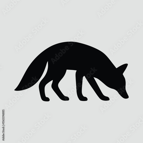 Silhouette of a fox sniffing the ground vector illustration