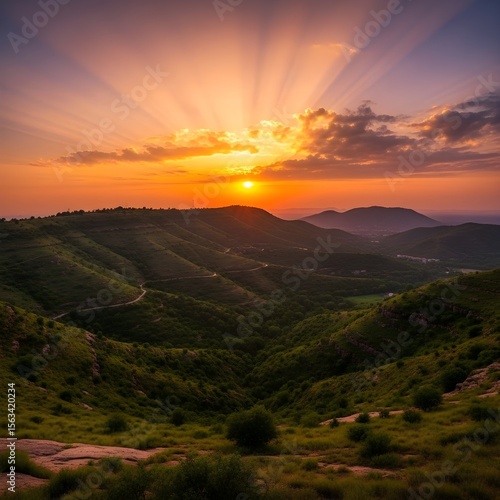 Lush Green Mountain Valley Under Clear Blue Sky | Dense Forest and Green Peaks in Mountain Range 
