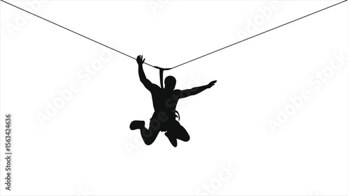 A daring silhouette of a man zipping through the air on a zipline against a clear sky