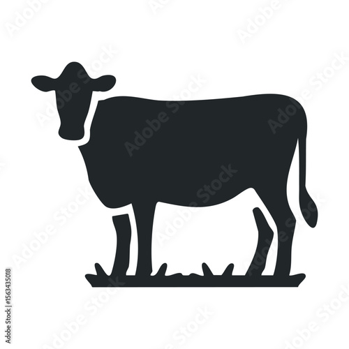 Silhouette of a standing cow grazing in a pasture: peaceful black vector illustration