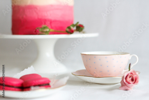 Wallpaper Mural Pink tea cup beside macaron and cake Torontodigital.ca