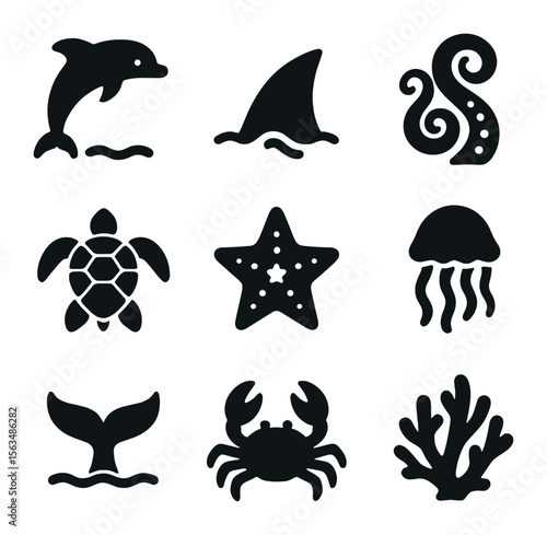 Marine Life Icons. Solid, filled icons set of marine creatures: jumping dolphin, shark fin, octopus arms, sea