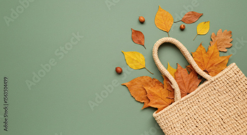 Autumn tote with leaves and acorns flat lay.