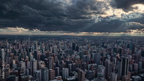 Wallpaper Mural Dramatic clouds and sunlight over bustling city skyline Torontodigital.ca