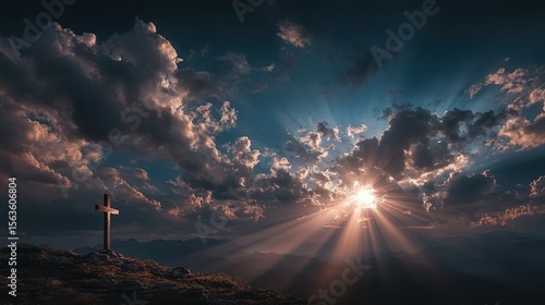 Sunrise over mountains with a cross silhouette and dramatic clouds illuminating the sky