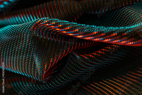 Abstract close-up of shimmering, folded fabric or mesh with glowing blue and red dots in wave-like patterns – futuristic texture for technology, textile innovation, or digital design themes
