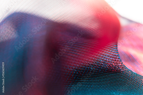 Vibrant abstract mesh texture in red, blue and violet tones – dynamic digital background evoking movement, energy and depth, ideal for creative industries, design, and modern visual art