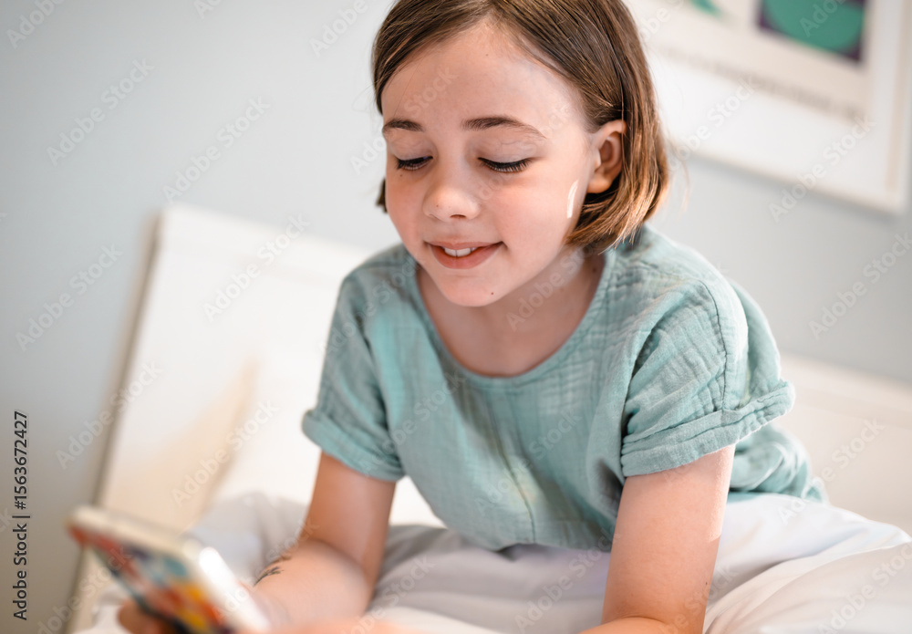 Child with smartphone before bedtime. Child with smartphone before bedtime.