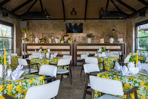 Interior of an Italian-style restaurant with traditional decor, elegant table settings, wooden furniture, and Mediterranean ambiance