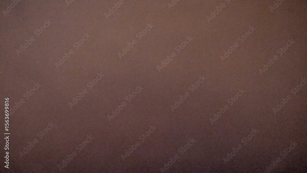 Fototapeta premium Plain dark brown textured background with a subtle gradient, offering a versatile and earthy backdrop