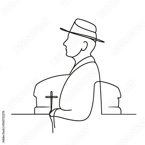 Man in a hat standing beside coffins holding a cross at a funeral, funeral procession