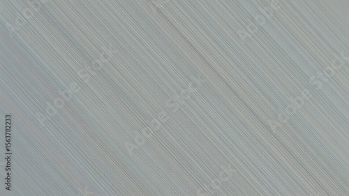 Texture of brushed metal surface with fine linear patterns, industrial background for design, technology themes, modern style, cool gray tones, sleek and minimalistic appearance, close-up detail view