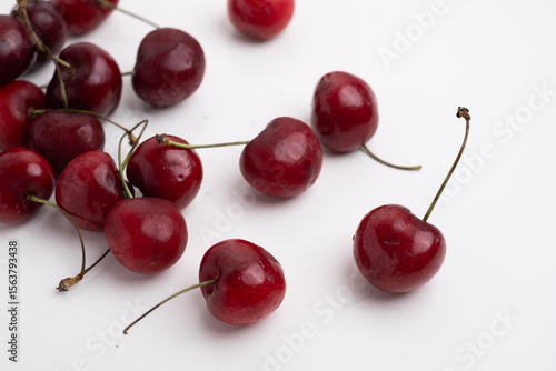 Fresh cherries in a ceramic cup on the table. A handful of delicious berries. Antioxidants and vitamins
