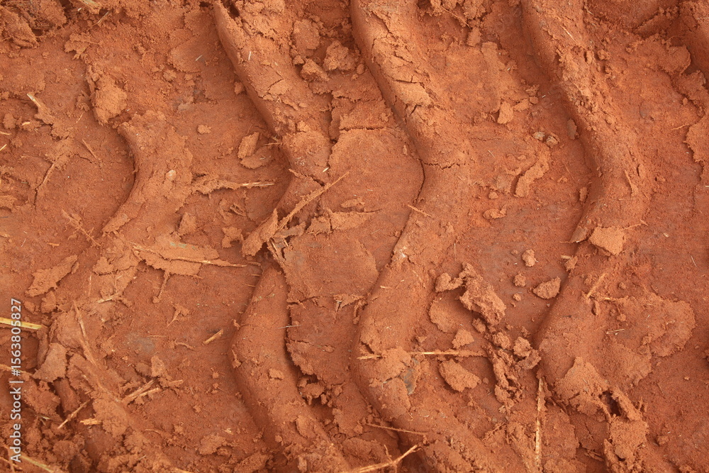Obraz premium Close-up of a Tractor Track on the Ground