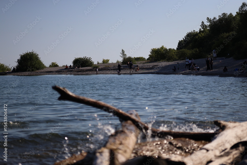 Fototapeta premium Landscape view of lake and beach, photo was taken from Rough Hill, Toronto. The photo was taken in East York on 30 June 2025