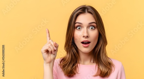 Astonished Woman with Surprised Expression and Pointing Finger Upward