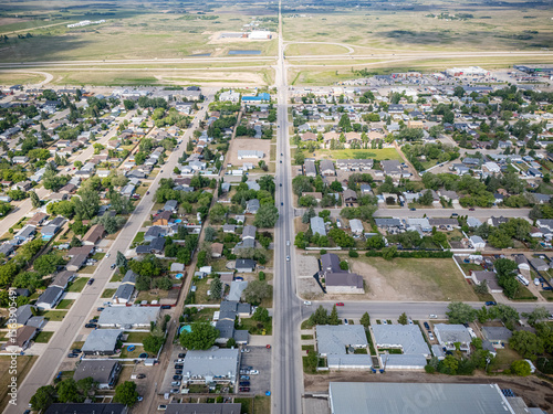 Fototapeta Naklejka Na Ścianę i Meble -  City street with houses and a few cars