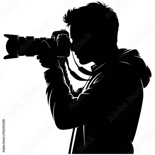 Silhouette of photographer holding camera in hand